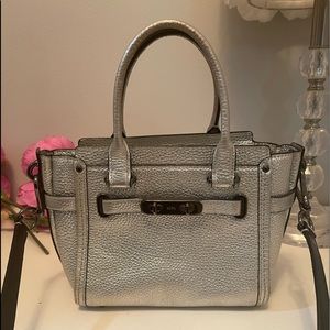 COACH SWAGGER WRISTLET IN silver

color: dark antique nickel silver